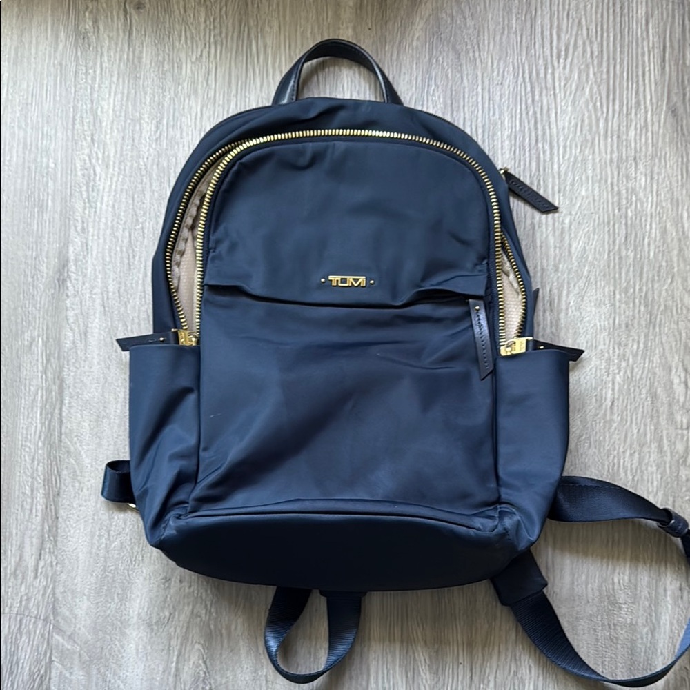 Tumi Navy Backpack with Gold Details